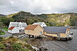 View of the Vågsberget handelsstad, along the shore in Vågsvåg