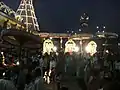 Procession in front of the main entrance of the temple