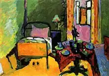 Picture of an interior with bed, pedestal table, window and curtains painted in very bright colours.