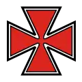 an insignia in the shape of a red maltese cross with a black outline