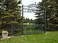 Veeder Cemetery gate behind school building