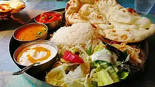 Traditional North Indian vegetarian thali with various curries from India. Various curry dishes are found across South Asia.