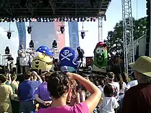 The VeggieTales characters (left to right) of Mr. Lunt, Pa Grape, and Larry the Cucumber on the main stage dressed up in costume for the film The Pirates Who Don't Do Anything: A VeggieTales Movie which was released on January 11, 2008.