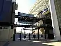 Gates now dwarfed between and beneath the south and east stands