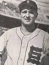 Victor Starffin in baseball hat and uniform, looking at the viewer