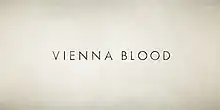 A distressed cream colored background to the logotype "Vienna Blood"