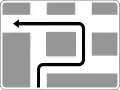 Advance direction sign for route to be followed to turn left, where a left turn at the next intersection is prohibited