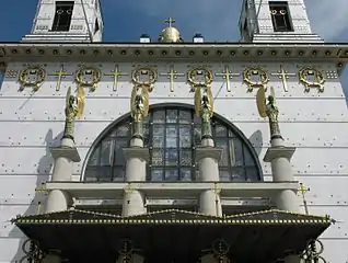 Detail of the facade, with sculpture by Othmar Schimkowitz and tower