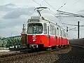 Type E6/C6 crossing a bridge over the Wienzeile