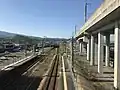 View of the platforms and tracks. A siding can be seen in the distance to the left.