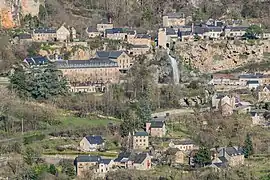 A view of the town from the west with the Cascade de Salles-la-Source