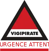 Vigipirate triangle with "Urgence Attentat" in red font