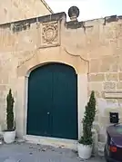 Cagliares coat-of-arms above courtyard entrance.