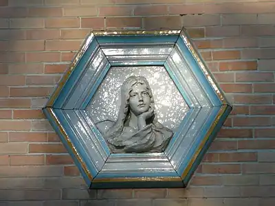 Hexagonal ceramic medallion on the Villa La Sapinière, Évian-les-Bains, France, architect Jean-Camille Formigé and sculptor Alexandre Falguière, 1892-1896