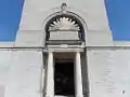 The inscriptions in English and French either side of the memorial tower entrance