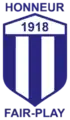 The former Violette AC crest (???–2014). A slight modification of the original crest from light blue to blue and the words Honneur and Fair-Play added.