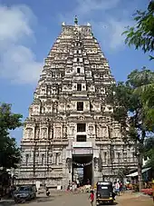 Very high gate-like structure decorated with many niches.