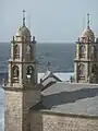 high crosses topping the sanctuary of a Virxe da Barca ('Our Lady of the Boat'), Muxía