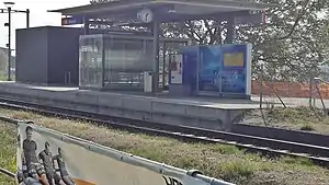 Canopy-covered shelter on a platform