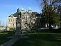 A view of the Old Capitol with statue of J. R. Rogers, first governor of Washington State.