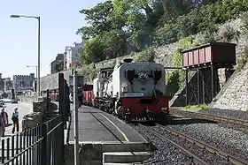 Welsh Highland train and water tower at Caernarfon below the walls of Segontium Terrace.