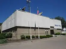 A two-story 1960s-vintage building with WQAD TV signage