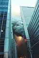 Heavy fire showing from WTC 7's eastern side, with WTC 5 visible in the background, also on fire.