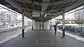 View of the platforms looking toward Ikebukuro, showing the toilet block and former smoking area, November 2011