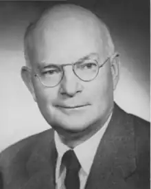 the article subject dressed in a jacket and necktie, facing the camera