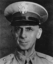 Black and white head shoulders photo of Major General Walter S. Grant in dress uniform and cap, circa 1942