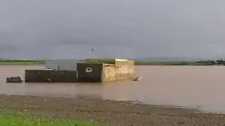 Warar, a natural temporary lake, in 2008, flooding a house built in the 1970s