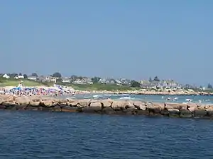 A photo of Weekapaug showing the breachway, jetty, channel, Fenway Beach, and numerous ocean front homes.