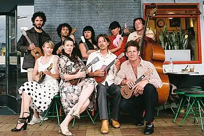 Members of the Wellington International Ukulele Orchestra outside the Deluxe Cafe in Wellington, New Zealand.