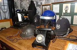 Exhibits at the Coventry Police Museum including the historic charge desk which was used for over 100 years