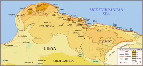 Topographic map of north east Libya (Cyrenaica) and north west Egypt. To the south lies the Great Sand Sea and the Qattara Depression; to the north, the Mediterranean Sea. The area in between is dominated by the high ground close the coast. The highest is the Jebel Akhdar in northern Cyrenaica between Benghazi in the east and Derna in the north, about 150 km away. Tobruk lies about another 150 km further east. Bardia lies another 110 km further east still, still in Cyrenaica but close to the border with Egypt. All are coastal towns. Roads and railways generally follow the coast, and there are only tracks in the interior.