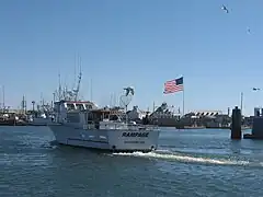 A typical fishing boat returning to the Westport Marina