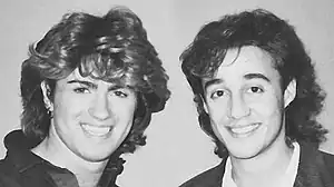 A black-and-white photograph of the members of the American pop duo Wham!, circa 1985.