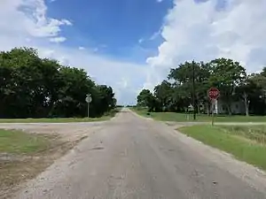 There is a single house at the Plainview crossroads.