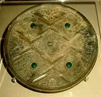 A late Zhou or early Han Chinese bronze mirror inlaid with glass, perhaps incorporated Greco-Roman artistic patterns