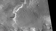 Fans in Baltisk crater, as seen by CTX camera. Note: this is an enlargement of a previous image.  Arrows point to layered parts of the fans.