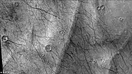 Close up of eskers in Lau Crater, as seen by CTX camera (on Mars Reconnaissance Orbiter).  The dark lines are dust devil tracks.  Note: this is an enlargement of the previous image of Lau Crater.