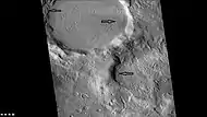 Northeast rim of Quenisset Crater, as seen by CTX camera (on Mars Reconnaissance Orbiter). Note: this is an enlargement of the previous image of Quenisset Crater.  Arrows indicate old glaciers.