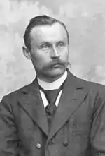 black-and-white photo of a man in a business suit