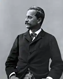 Black and white photograph of 19th-century Hawaiian man in Western suit, facing left