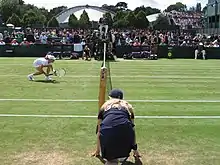 Image 50Wimbledon ball girl at the net, 2007. (from Wimbledon Championships)