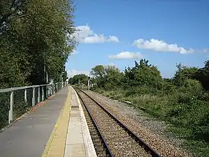 Station platform alongside a track