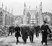 Winston Churchill visiting the ruins of the old cathedral in 1941.