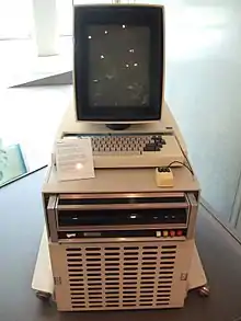 Computer with keyboard and monitor on top