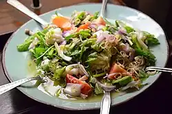 Thai yam takhrai kung sot (ยำตะไคร้กุ้งสด), a salad (yam) made with prawns and finely sliced fresh lemongrass