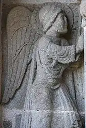 The angel of the Annunciation, at the west porch of the church of Saint-Georges